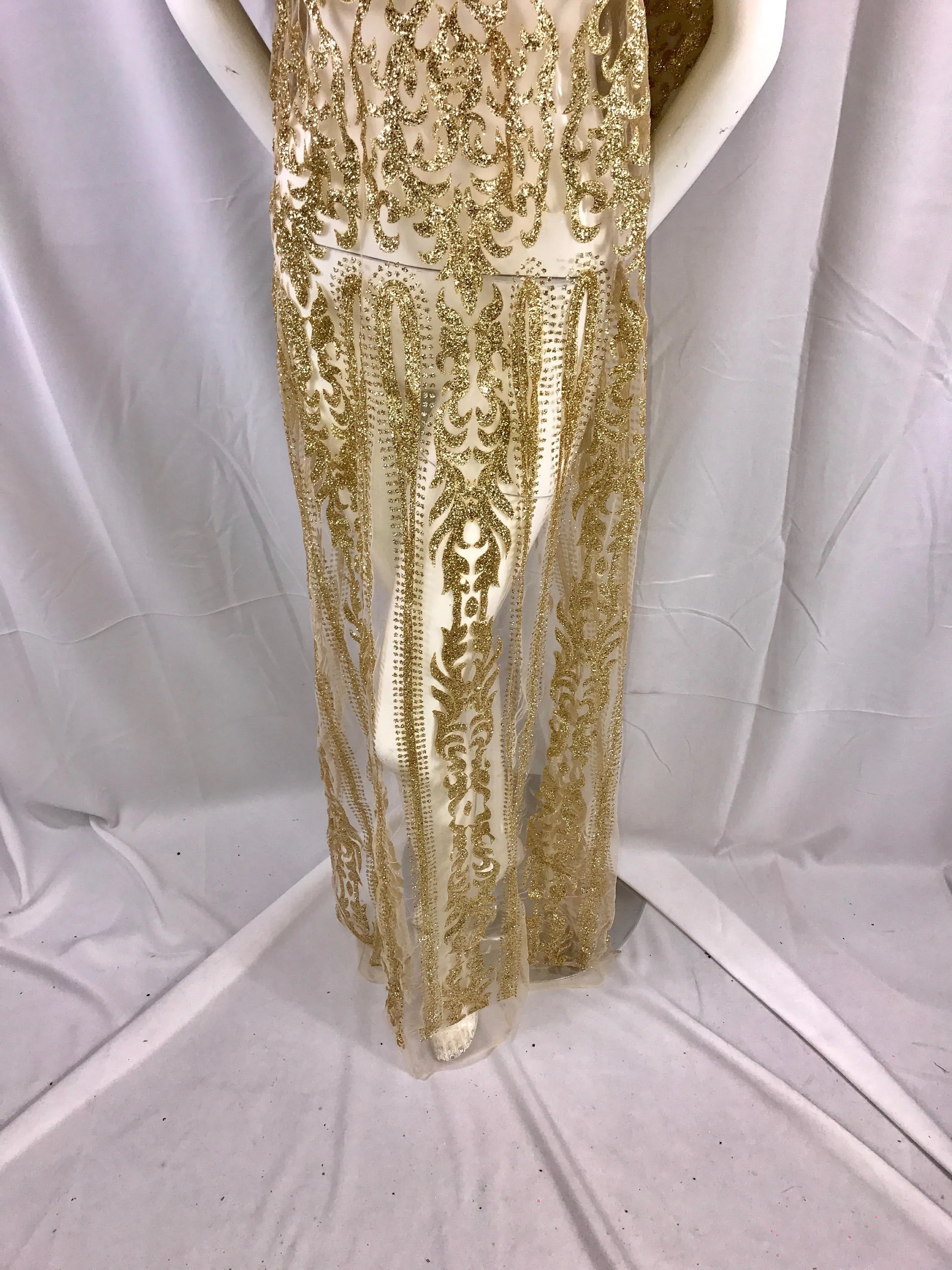 Gold shiny glitter damask design on a mesh lace-prom-decorations-apparel-fashion-nightgown-dresses-sold by the yard.