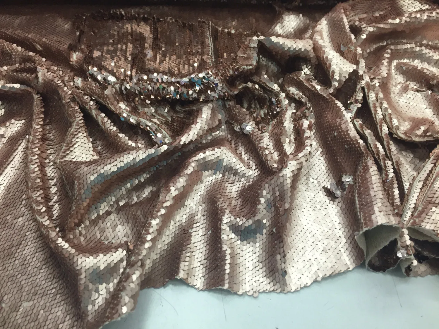 Matt gold/shinny rose gold hologram mermaid fish scales- 2 way stretch lycra- 2 tone flip flop sequins- sold by the yard.