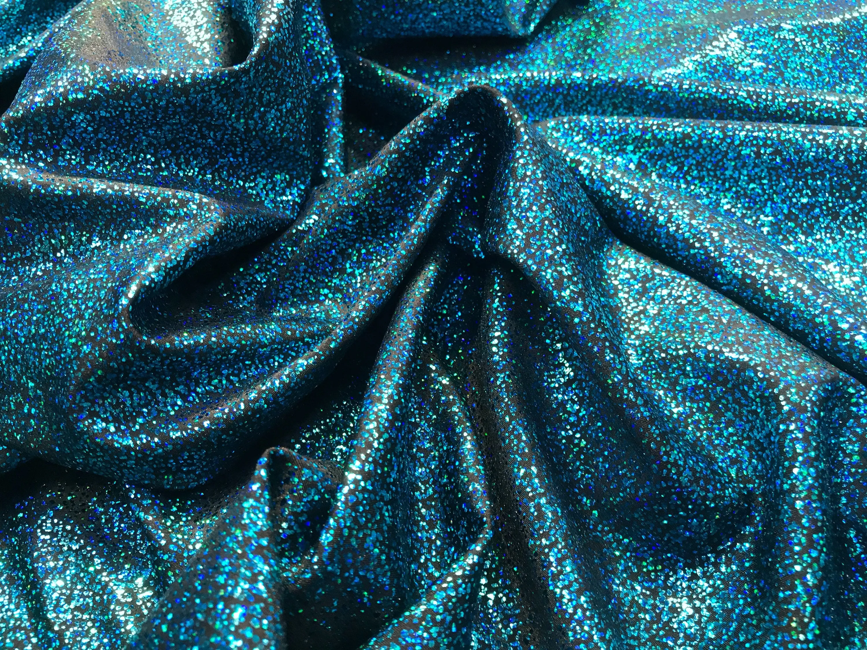 Turquoise-black iridescent shattered glass design 4 way Stretch nelon spandex-leggings-dresses-bathing suits-apparel-sold by the yard.
